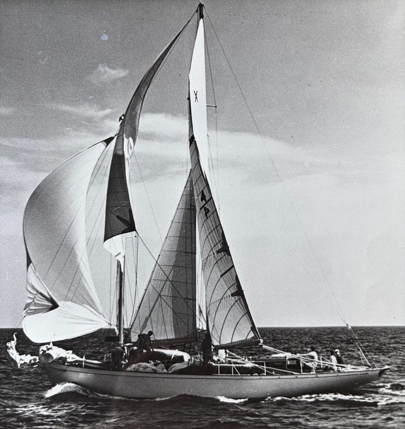 JADA racing under full sail in an archival black and white photograph